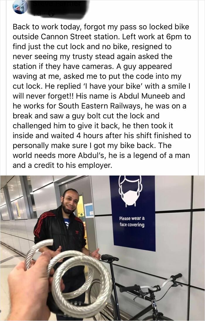 Man holding a cut bike lock with a railway worker smiling, restoring faith in humanity and kindness among strangers.