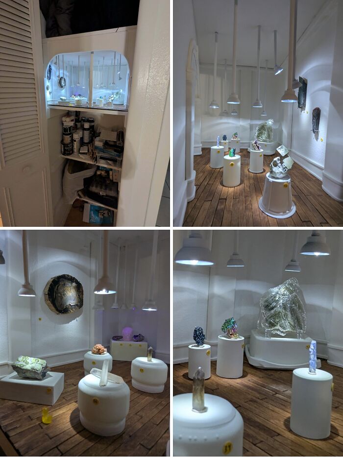 Miniature art exhibit showcasing creative projects with detailed lighting and unique installations on white pedestals.