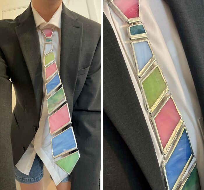 Person wearing a creative stained glass tie with colorful geometric shapes showcasing unique cool projects and creativity.