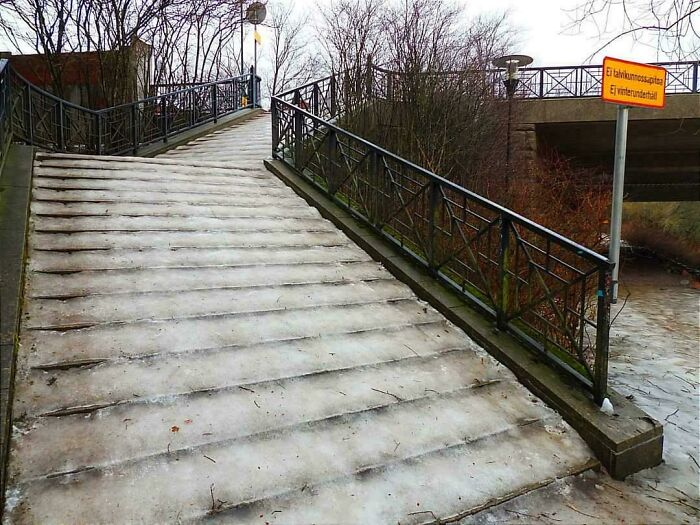 Steep icy stairs outdoors with metal railings, highlighting a risky Airbnb scenario needing insurance protection.
