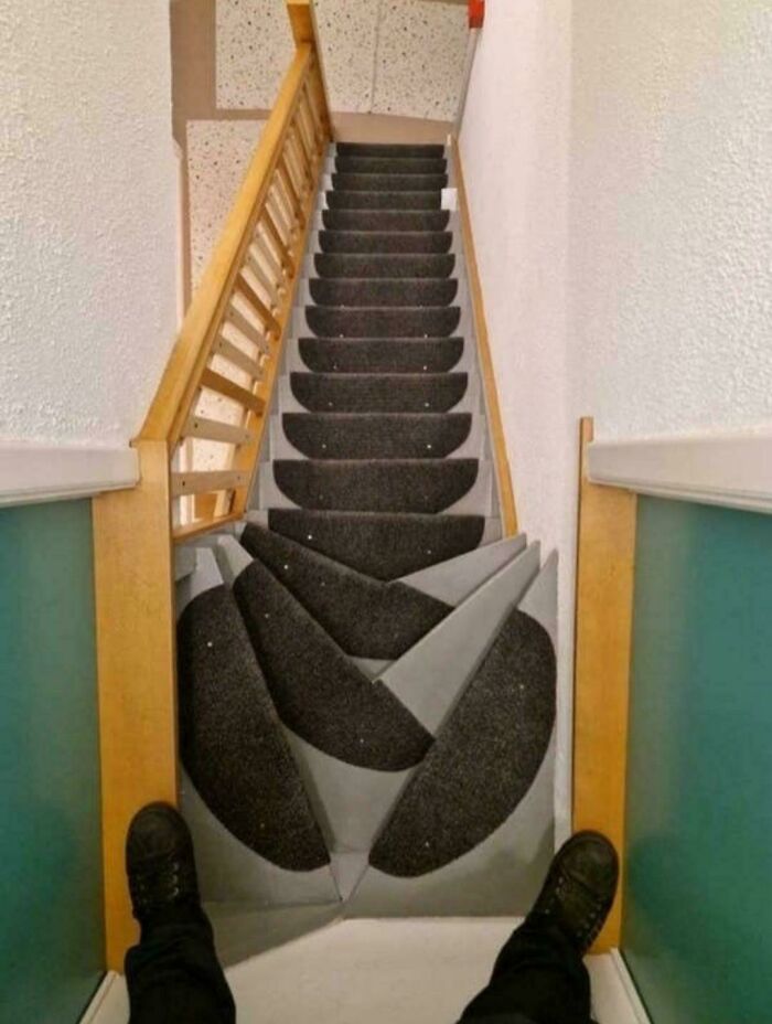 Steep and confusing stairs with risky design, illustrating the need for Airbnb insurance on hazardous properties.