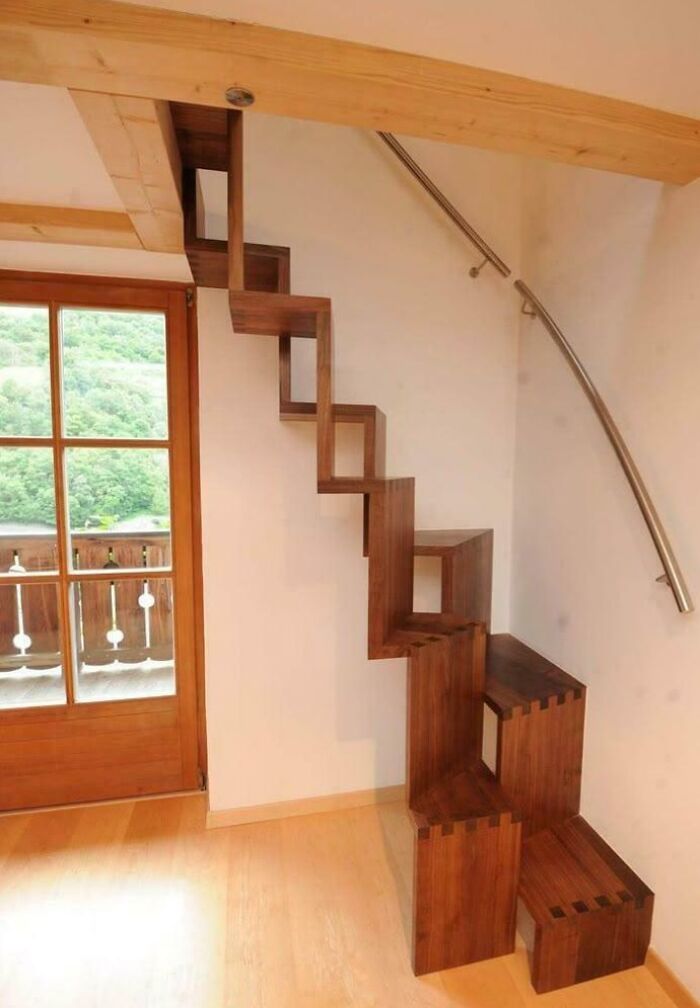 Unique wooden stairs with sharp angles and gaps, illustrating Airbnb insanity requiring careful insurance consideration.