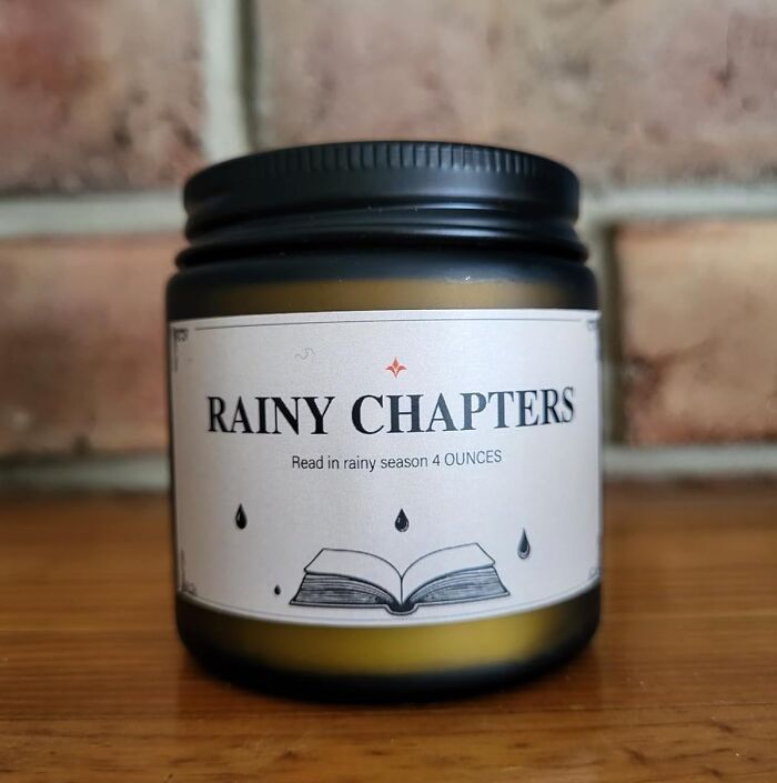 Candle labeled Rainy Chapters with book and raindrop icons, a unique gift idea for people impossible to shop for.