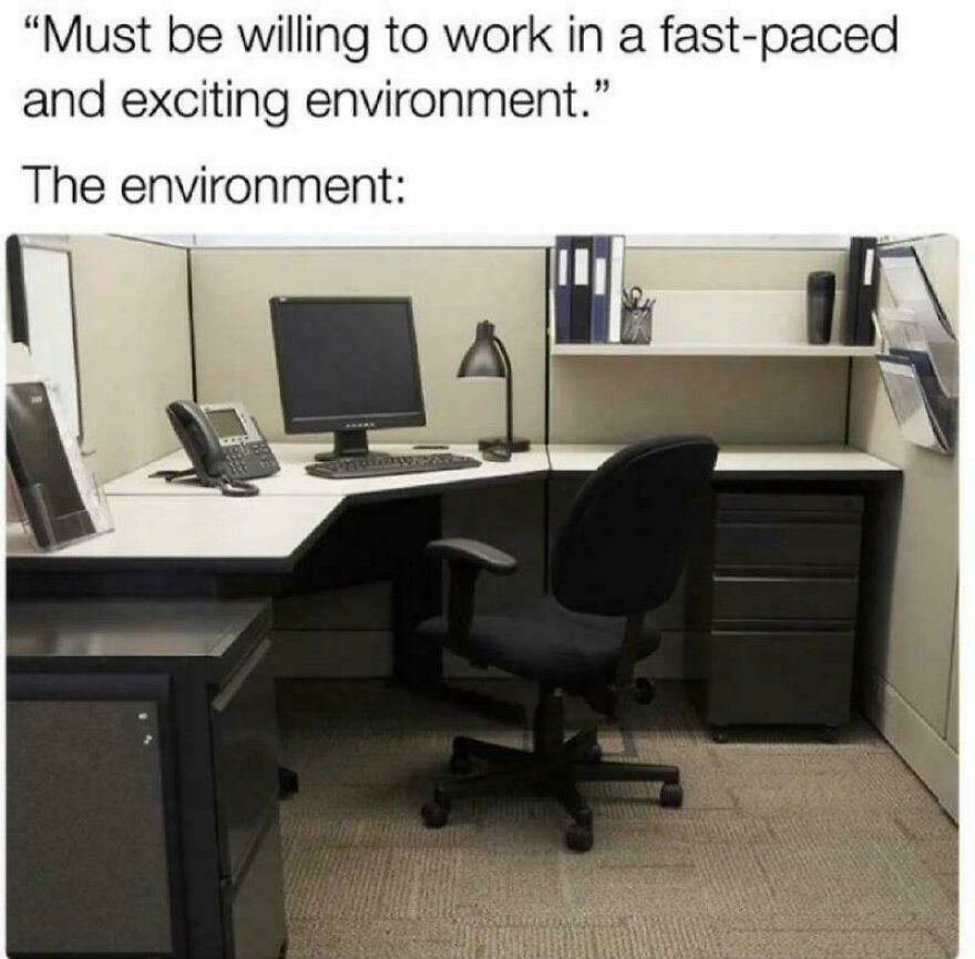 Empty office cubicle with computer and chair depicting a funny programming meme about debugging struggles in work environment
