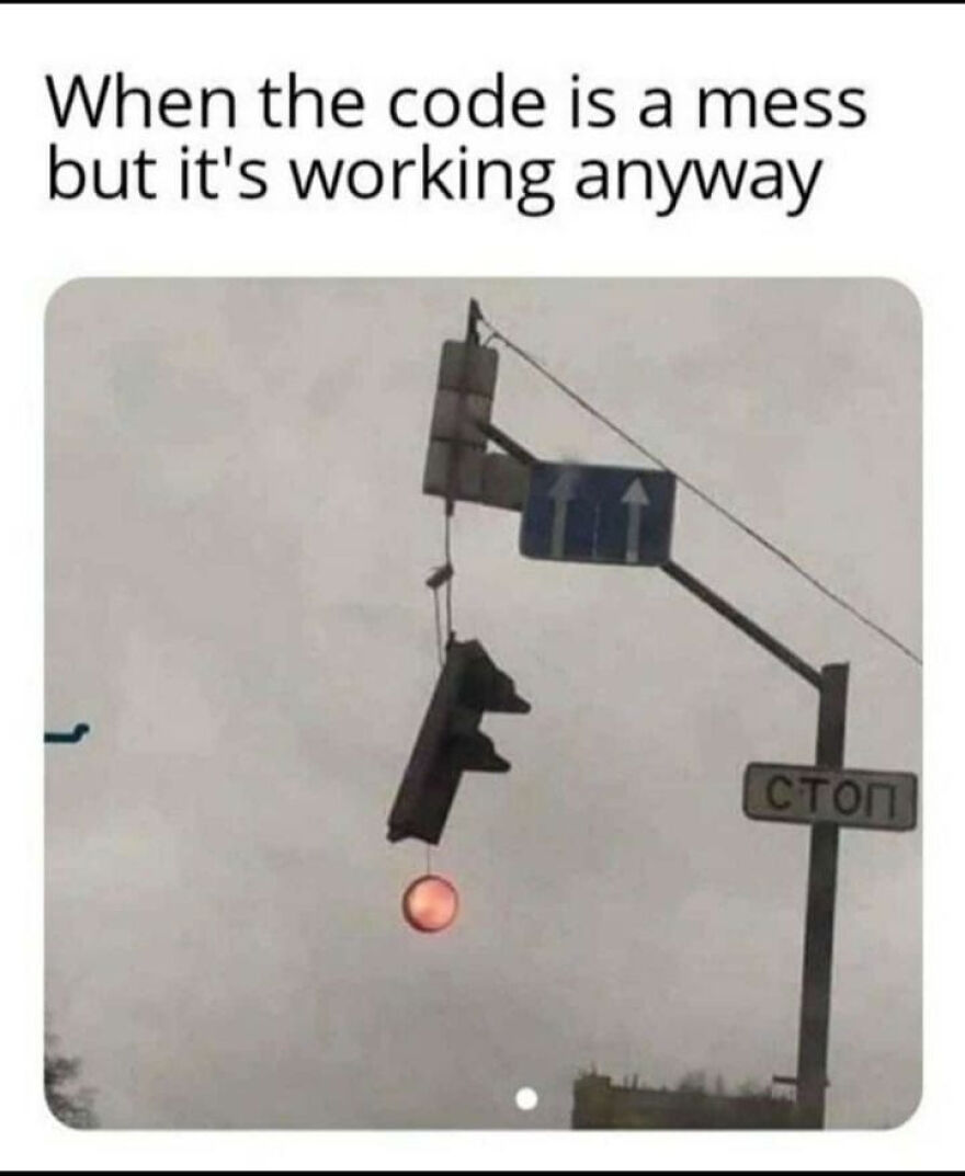 Broken traffic light hanging with red light on and caption about code being a mess but working, illustrating programming memes.