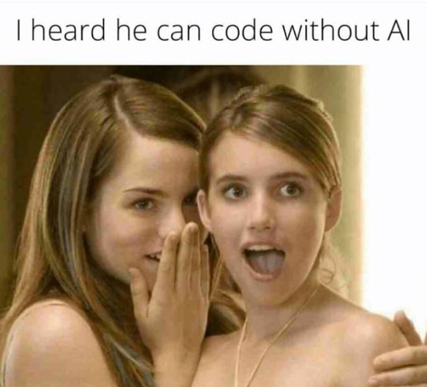 Two young women whispering and reacting with surprise to a funny programming meme about coding without AI and debugging struggles.