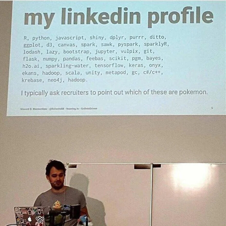 Man presenting a slide humorously listing programming languages and tools, highlighting universal debugging struggles.