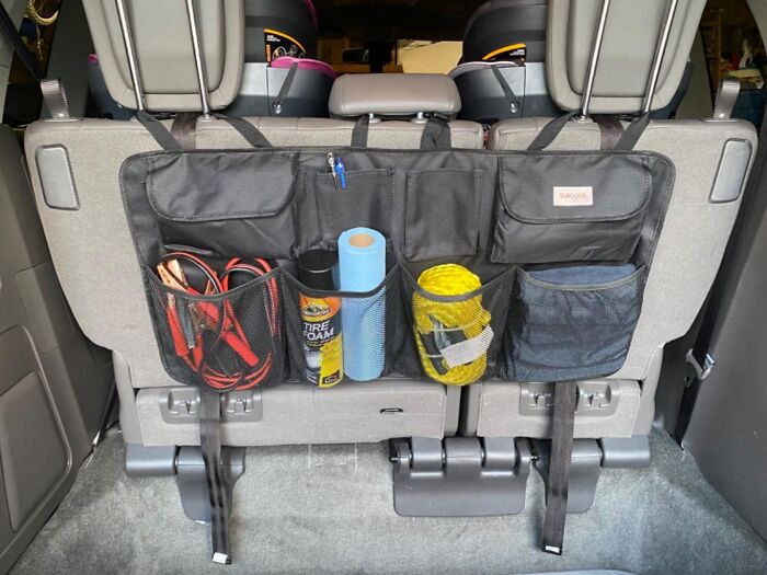 The Chaotic Jumble Of Emergency Supplies, Rogue Water Bottles, And That One Lonely Sneaker In Your Trunk Can Finally Be Tamed By A Car Trunk Organizer With 8 Pockets 