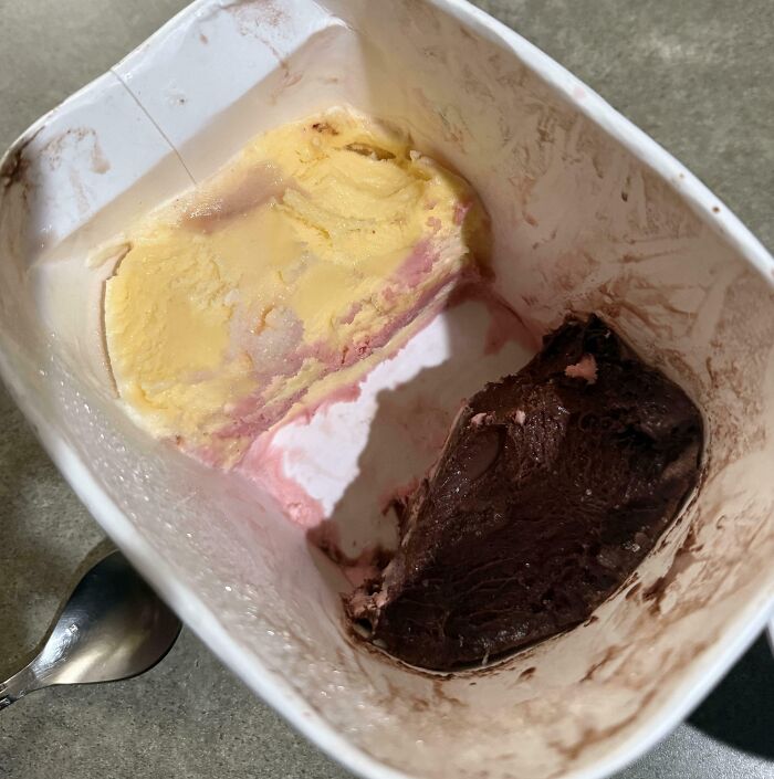 Partially eaten ice cream in a container showing uneven portions, reflecting family members infuriated moments online.