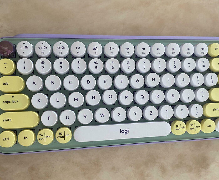 Colorful round key mechanical keyboard with yellow and white keys causing family members to vent online in frustration.