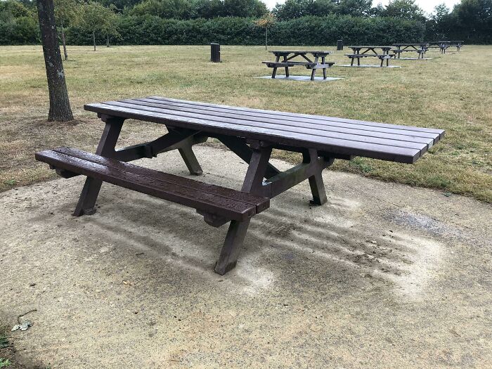 Park picnic table with extended bench seating, a smart idea and invention that truly solves a space problem outdoors.