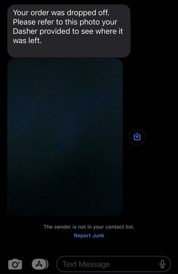 Text message from a delivery driver saying order was dropped off with a photo to show where it was left.