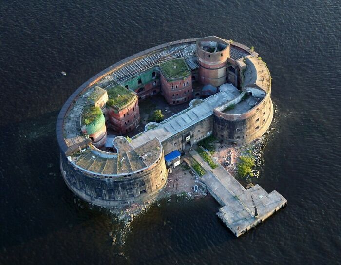 Aerial view of a historic fortress surrounded by water, showcasing a unique perspective of our world from above.