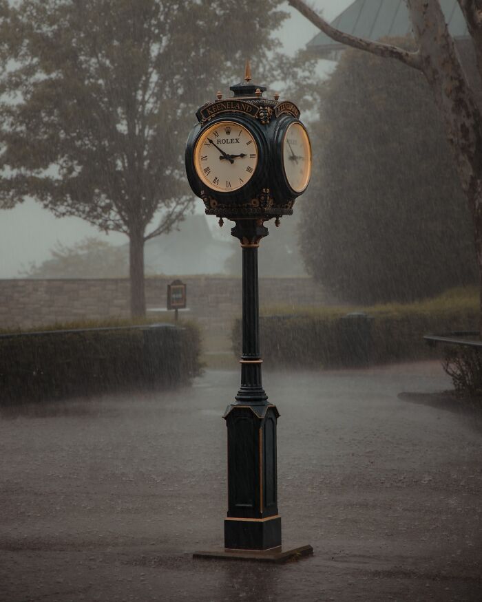 Vintage street clock showing time during heavy rain, capturing amazing pics of our world from a different perspective.