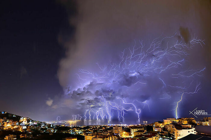 Dramatic lightning storm over a cityscape at night captured in amazing pics showing our world from a different perspective