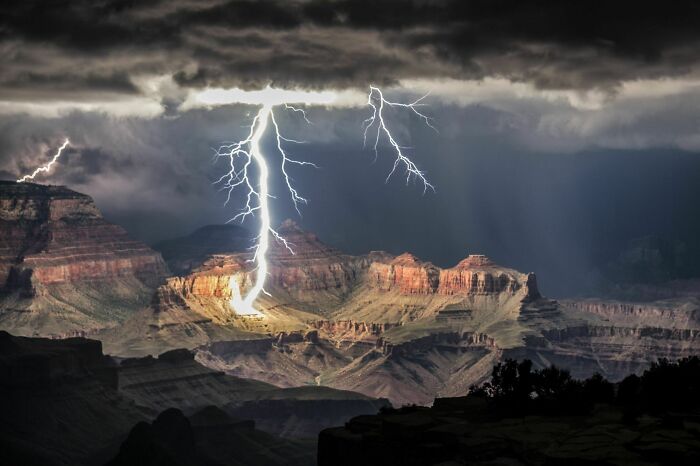 Lightning striking the Grand Canyon during a storm, showcasing an amazing view of our world from a different perspective.