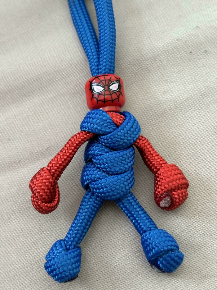 Spiderman figure made from red and blue braided rope, showcasing creativity and sibling gratitude craft.