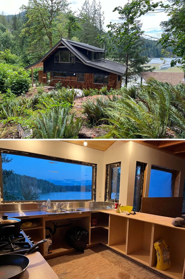 Cozy off-grid cabin surrounded by forest and a lake view kitchen with large windows overlooking nature at dusk.