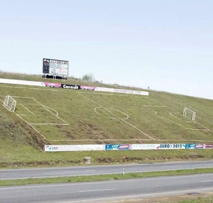 Soccer field drawn on a hillside with goals and markings, showcasing funny examples of people not even trying.