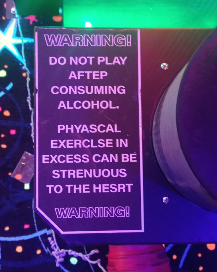 Warning sign with multiple spelling errors about alcohol consumption and physical exercise, showing a people not even trying example.