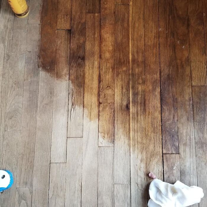 Wood floor being cleaned with products to help get full security deposit back from landlord restoration tips.