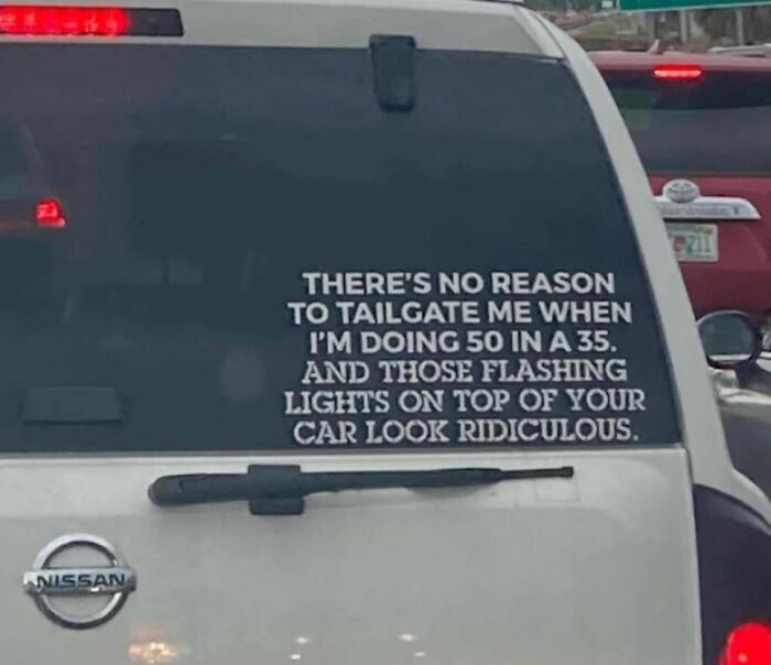 White Nissan SUV with a humorous decal about tailgating, reflecting relatable student and young adult life experiences.