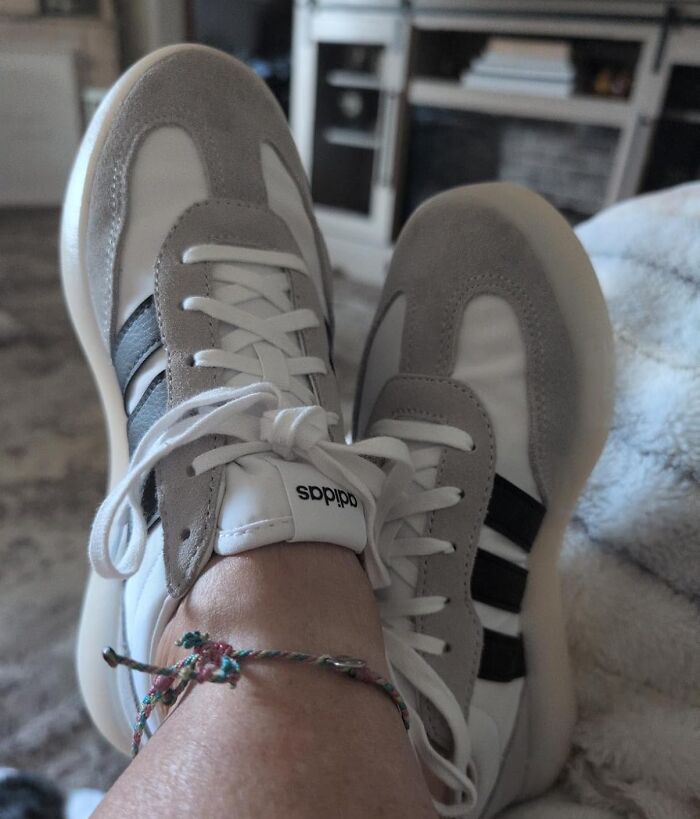 Casual Adidas sneakers worn on feet, highlighting stylish gifts perfect for holiday shopping satisfaction.