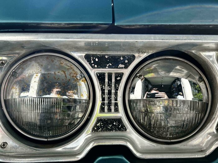 Close-up of vintage car headlights showcasing smart ideas and inventions that truly solve a problem in automotive design.