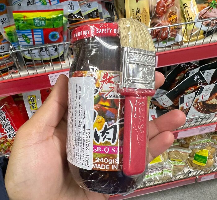 BBQ sauce bottle with an attached brush for easy application, showcasing a smart problem-solving invention idea.