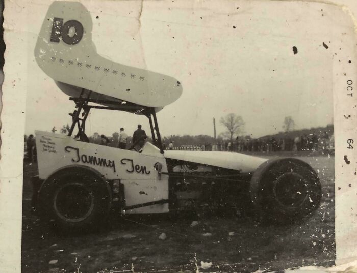 Vintage race car named Jammy Ten with large wing, captured at an outdoor event, illustrating unique where was this taken posts.