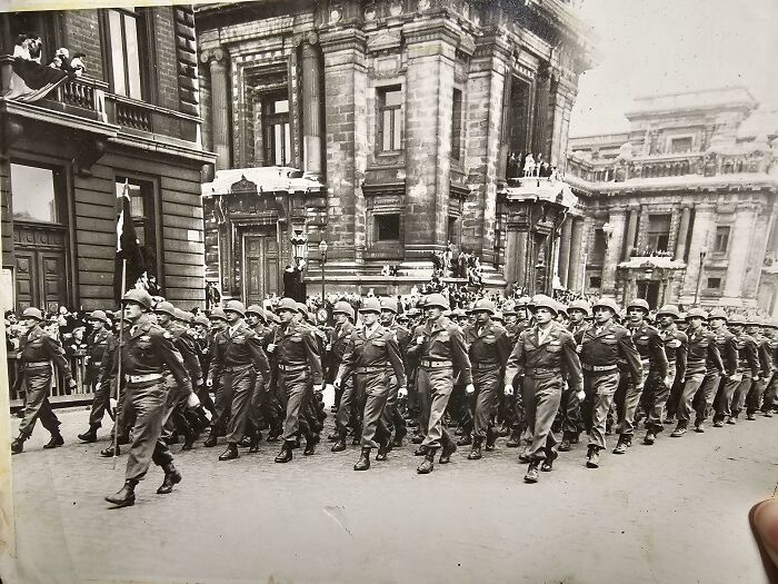 Black and white photo of soldiers marching in front of historic buildings in a where was this taken internet post.