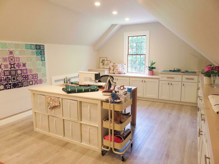 Cozy craft room with organized storage and natural light, showcasing how people turned their dreams into reality.