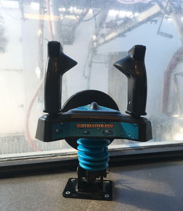 Dual-handle smart invention tool designed to clean windows more efficiently, showcasing a practical problem-solving idea.