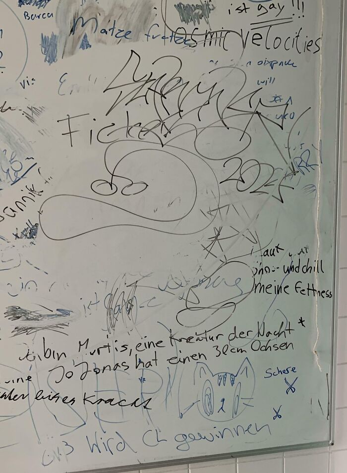 Whiteboard covered with various random handwritten notes, sketches, and doodles illustrating creative problem-solving ideas.