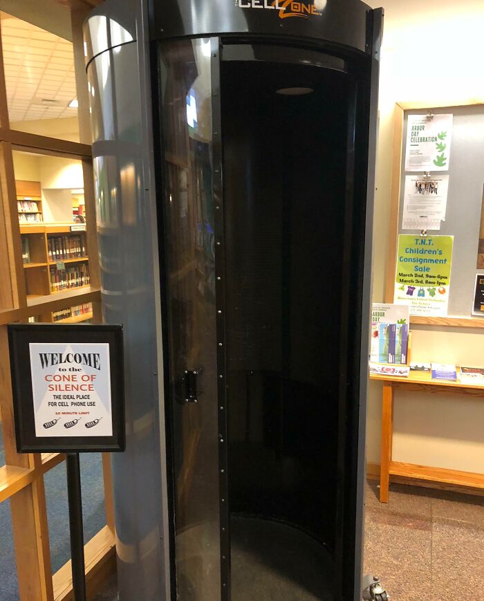 Phone booth called Cone of Silence in library offering a quiet space for cell phone use, a smart idea solving noise problems.