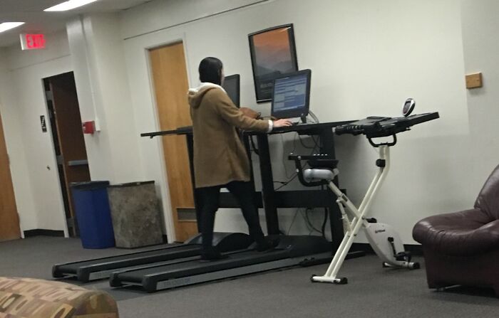 Person using a treadmill desk setup in an office space demonstrating smart ideas and inventions that solve everyday problems.
