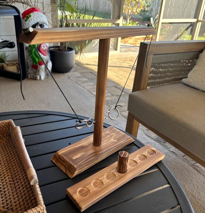 The Only Appropriate Way To Settle A Family Feud Over The Last Slice Of Pumpkin Pie Is With A High-Stakes Tournament Of The Wooden Hook And Ring Game 