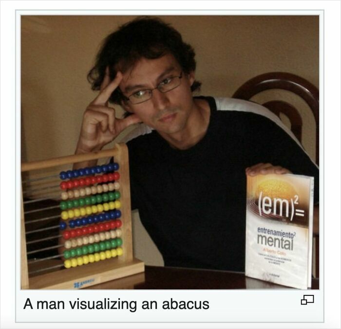 Man concentrating on abacus and mental training book, a humorous moment people shared online from Wikipedia pages.