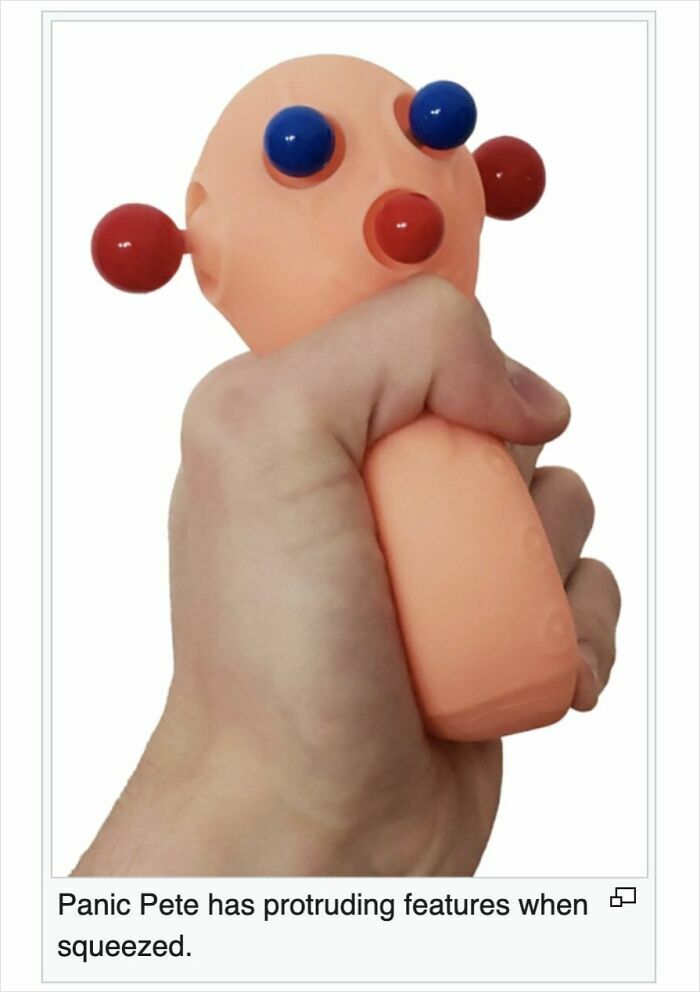 Hand squeezing Panic Pete stress toy showing protruding features, a humorous item shared on Wikipedia pages online.