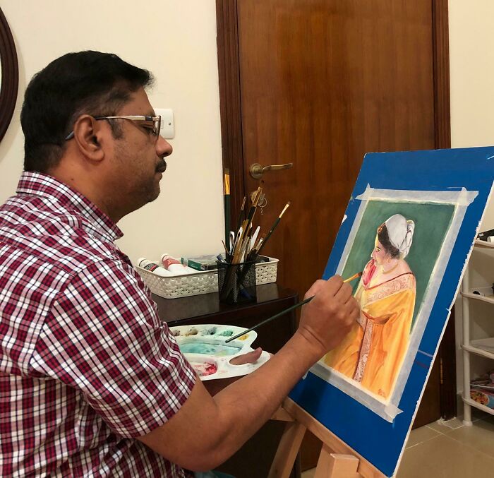 Man painting a detailed portrait on canvas, turning dreams into reality with creativity and artistic inspiration.