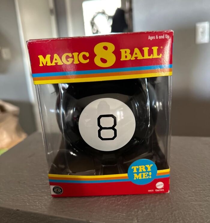 Magic 8 Ball game in red and yellow packaging, a popular stocking stuffer gift for holiday celebrations.