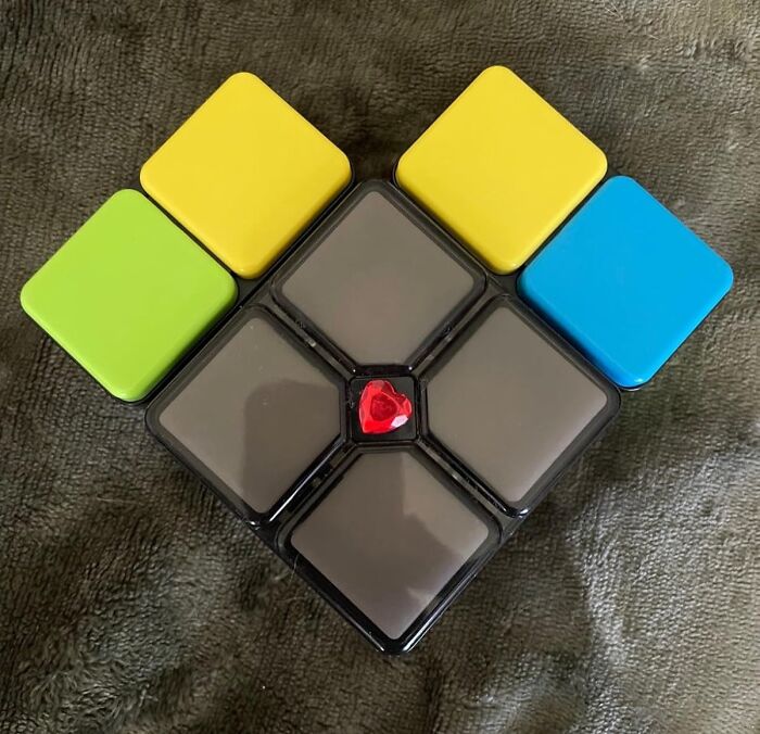 Colorful puzzle toy with a red heart-shaped piece in the center, a unique stocking stuffer gift idea.