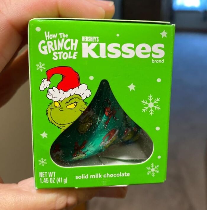 Green box of Hershey's Kisses with How The Grinch Stole logo, a Christmas stocking stuffer solid milk chocolate candy.
