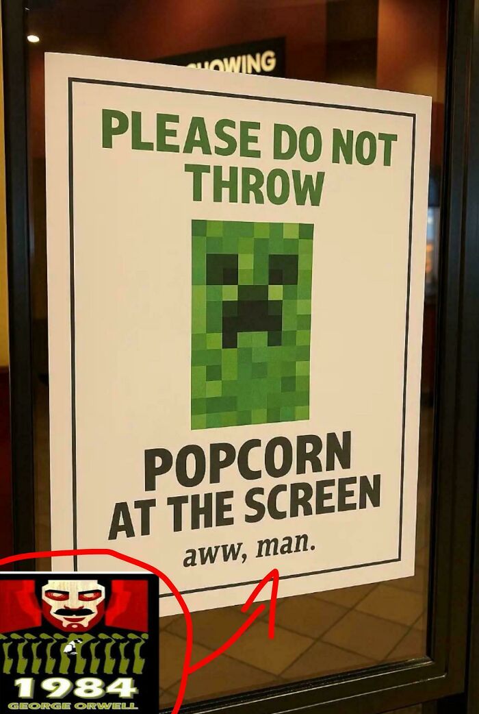 Sign with a pixelated green face warning not to throw popcorn at the screen, resembling things that look like or remind people of other things.