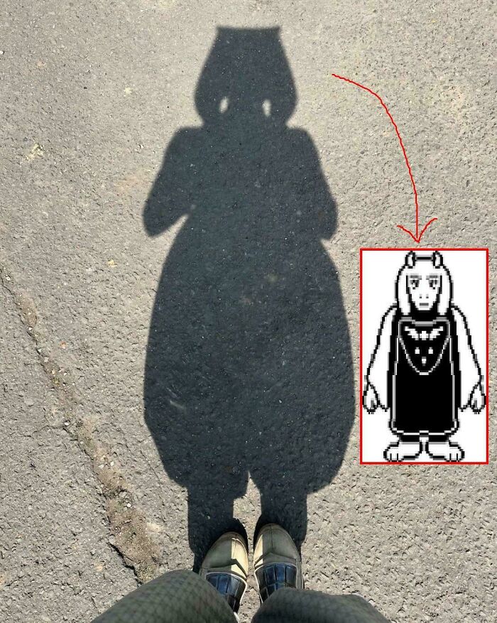 Shadow on pavement resembling a character from a video game, illustrating things that look like or remind people of others.