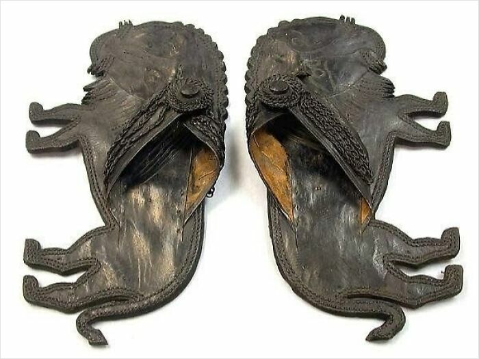 Very old leather slippers shaped like animals, showcasing ancient objects that reveal stories about our ancestors.