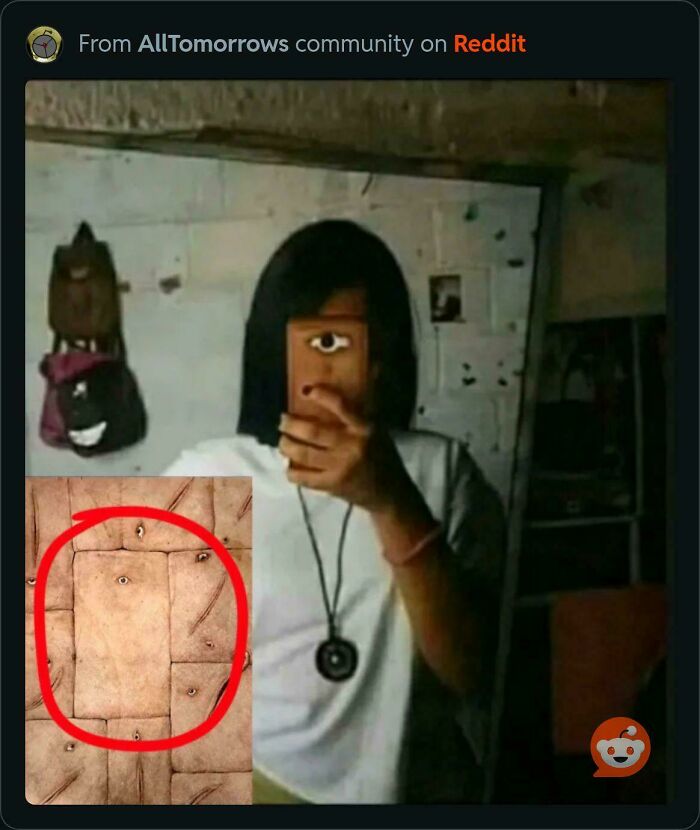 Person holding phone with an eye on the case, mimicking the pattern of other objects that look like eyes.