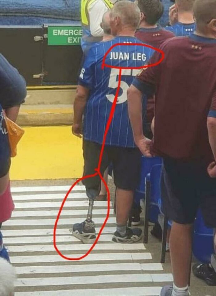 Man with a prosthetic leg wearing a jersey labeled Juan Leg, fitting the theme of things that remind people of other things.