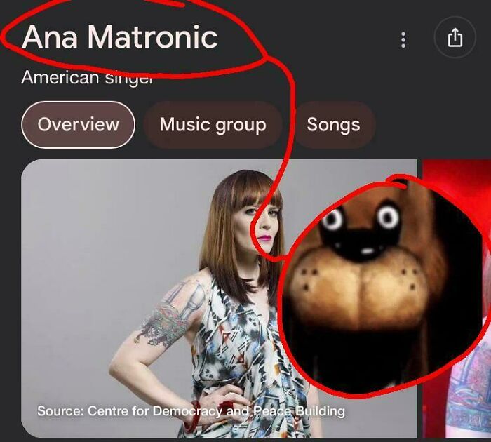 Woman with tattooed arm and brown hair next to an enlarged dog face that looks like other things.