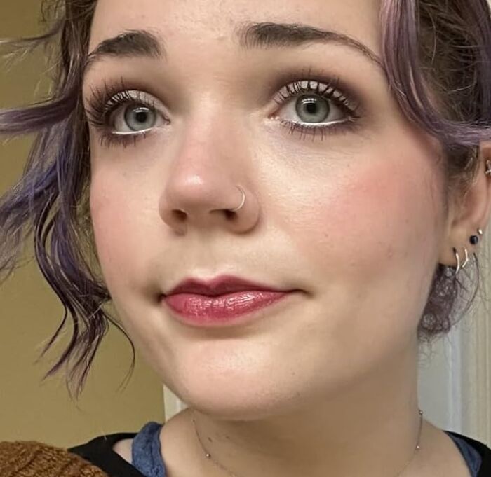 Close-up of a person with purple hair and nose ring, representing Black Friday week and hot deals excitement.